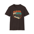 Dark brown My Bass Has Keys T-shirt with a wood-sided synthesizer with cream keys and teal accents.