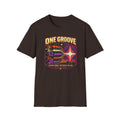 Dark brown One Groove T-shirt with instrument waveforms merging into a shared pulse.