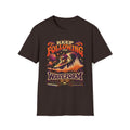 Dark brown Keep Following the Waveform T-shirt with a surfer riding a waveform above analog music gear.