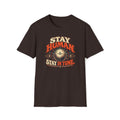 Dark brown Stay Human Stay in Tune T-shirt with a vintage tuning dial with a central pulse.