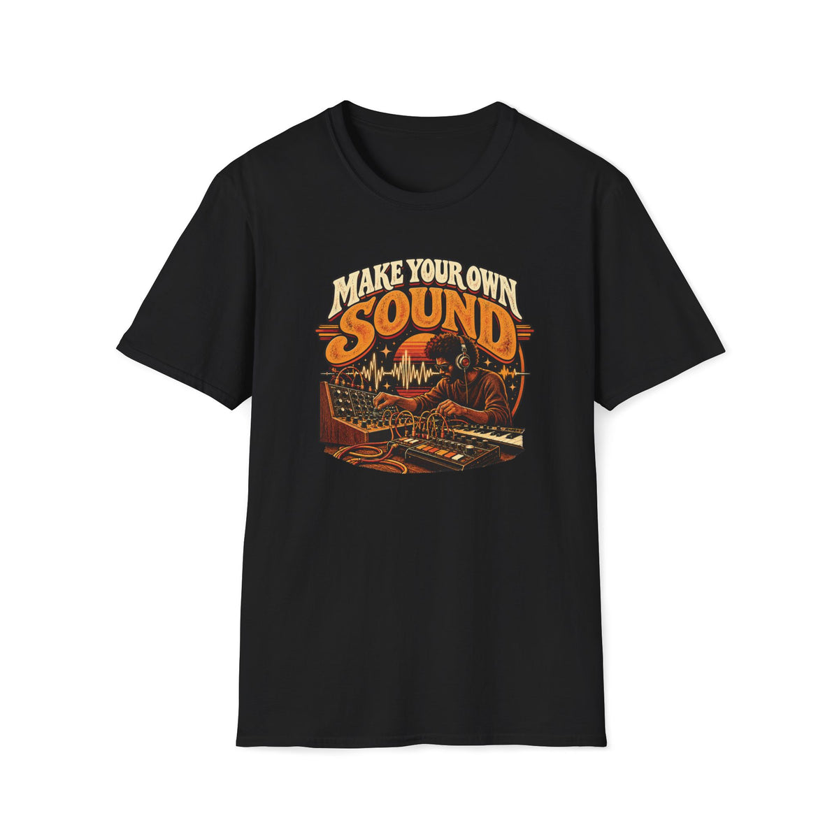 Black Make Your Own Sound T-shirt with a musician working with synthesizers and patch cables.