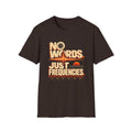 Dark brown No Words. Just Frequencies. T-shirt with bold cream lettering, a waveform, and audio controls.