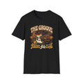 Black The Groove Above All Else T-shirt with hands playing a sunburst bass with flowing rhythm lines.