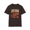 Dark brown Turn Feeling Into Sound T-shirt with a soulful figure surrounded by colorful sound waves.
