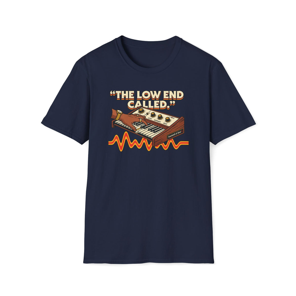 Navy “The Low End Called” T-shirt featuring a hand playing a retro synthesizer, cream lettering, and an orange-and-gold waveform.